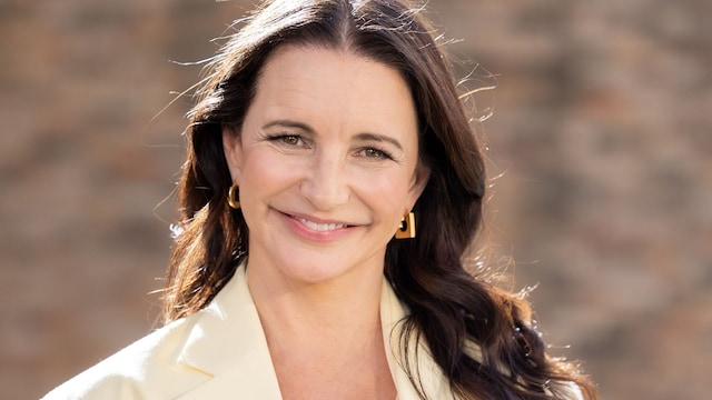 Kristin Davis wears yellow suit during fashion show in France