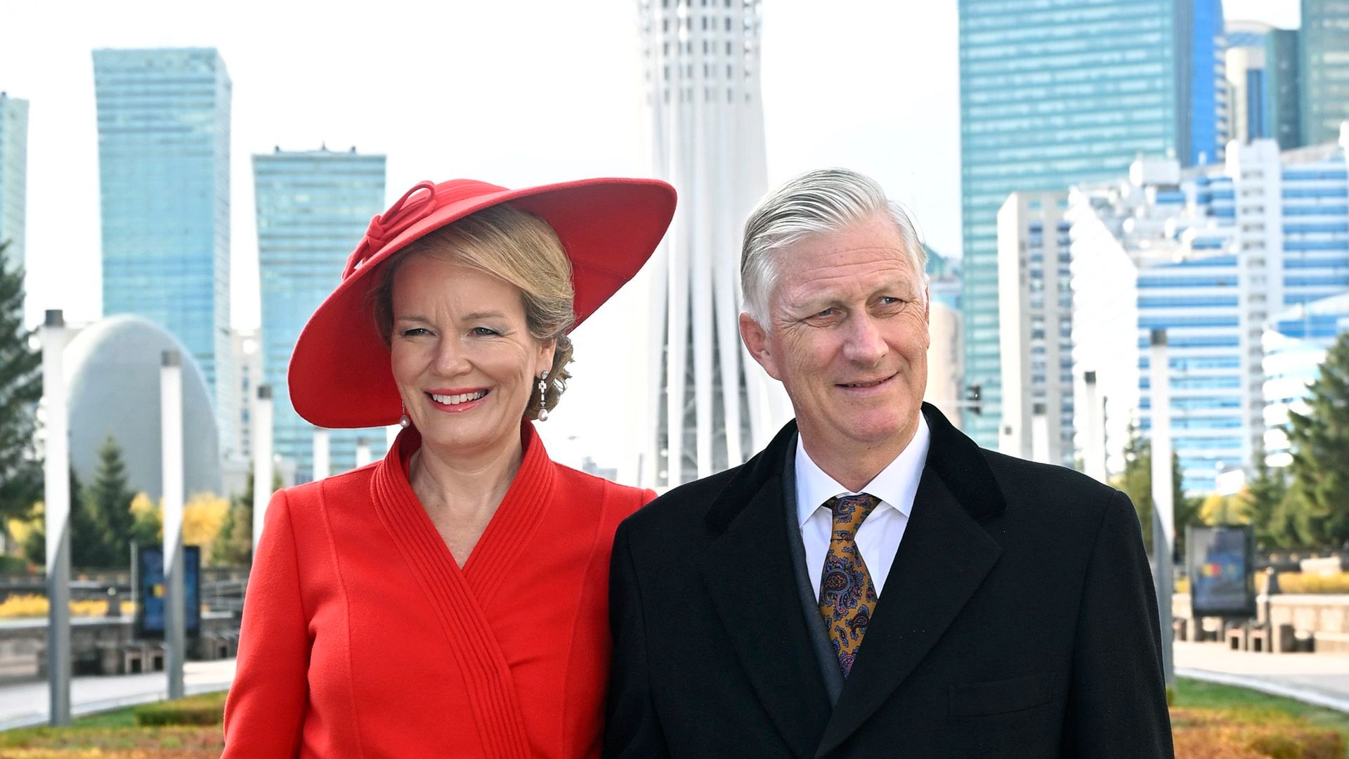Queen Mathilde turns heads in a vibrant red dress and dramatic hat during Kazakhstan visit