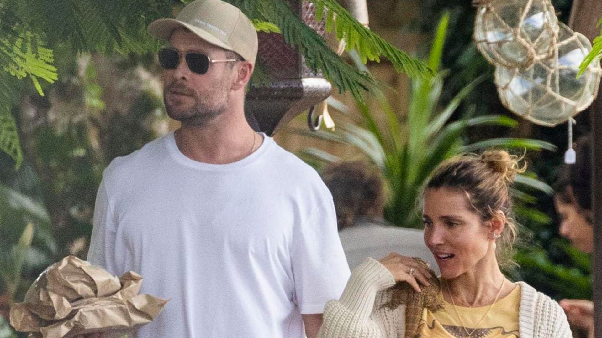 Elsa Pataky and Chris Hemsworth take their reptilian family member to the deli