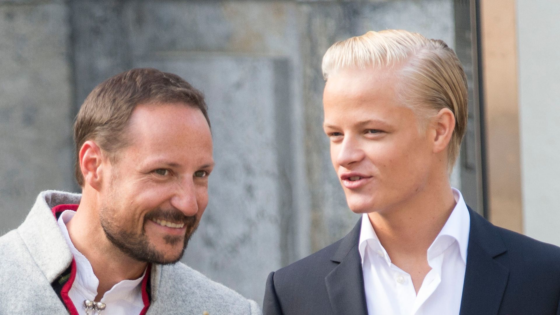 King Haakon of Norway and Marius Hoiby greet the Childrens Parade on the Skaugum Estate on May 17, 2014 in Oslo, Norway.