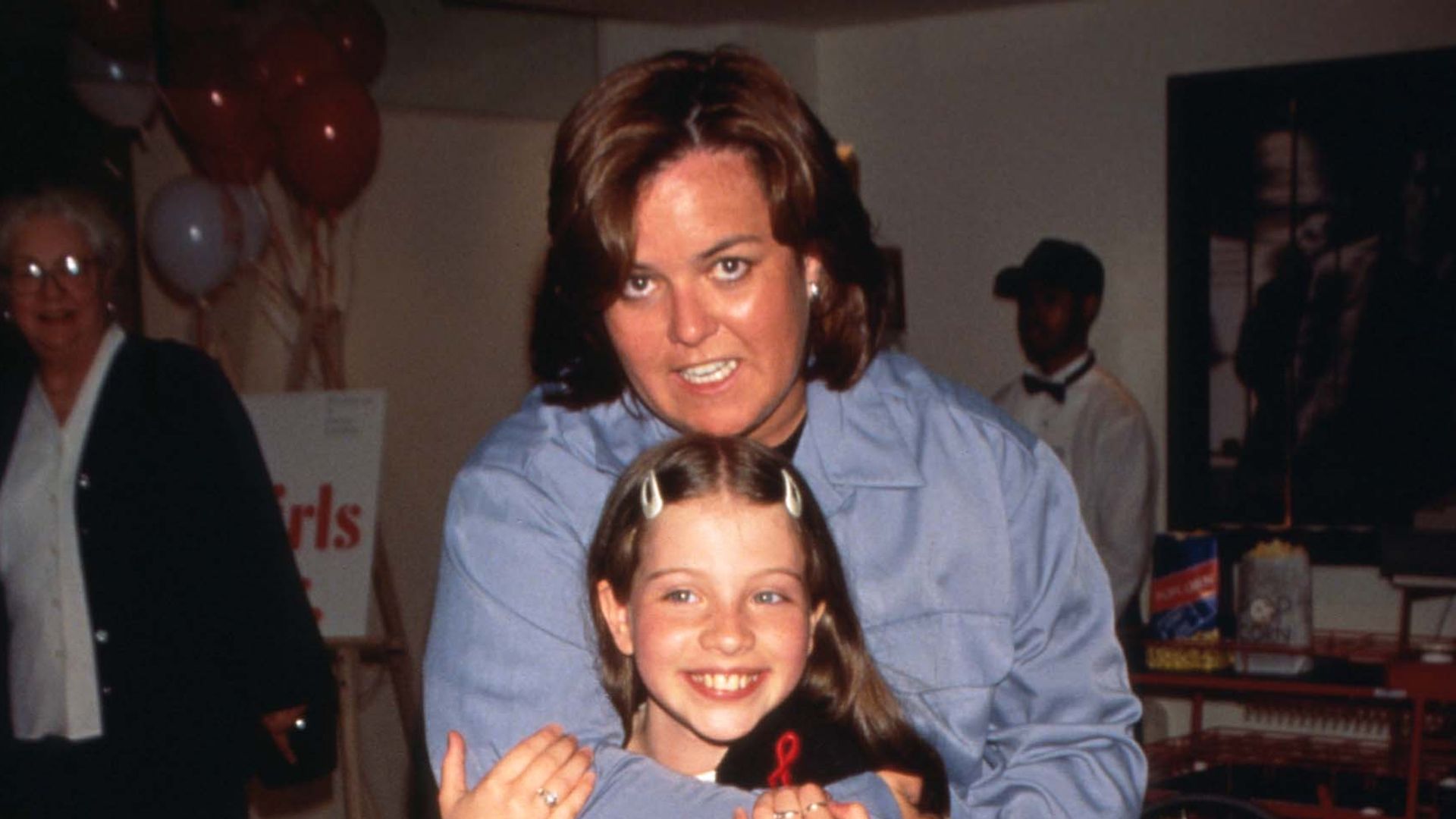275620 05: Talk show host Rosie O''Donnell embraces Michelle Trachtenberg at the premiere of "Harriet the Spy" July 9, 1996 in New York City. The film is based on the best-selling young people's novel about an eleven year-old girl who spies on her parents, neighbors and friends, detailing their comings and goings in her secret journal. (Photo by Evan Agostini/Liaison)