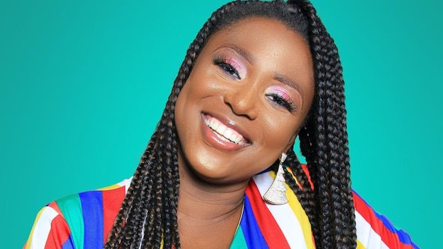 Black woman with radian smile.
