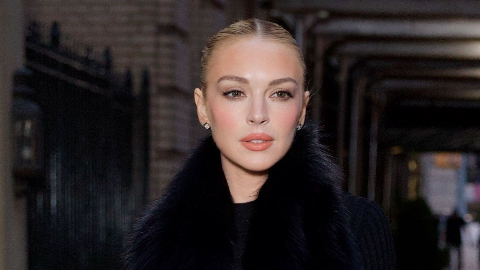 Lindsay Lohan flaunts flawless skin and fur minidress after revealing simple skincare secret