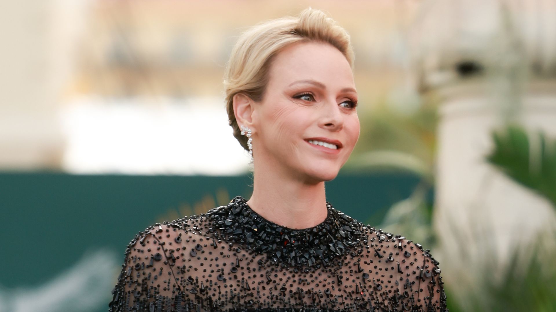 Princess Charlene wears a romantic white dress to meet the baby who made Monaco history