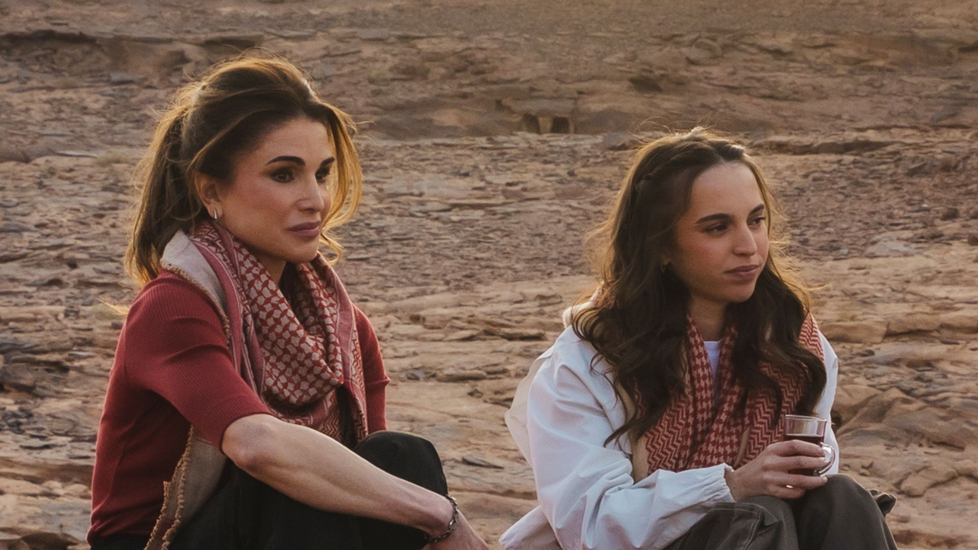 Queen Rania and Princess Salma sit with locals during their visit to Wadi Rum on January 8, 2026