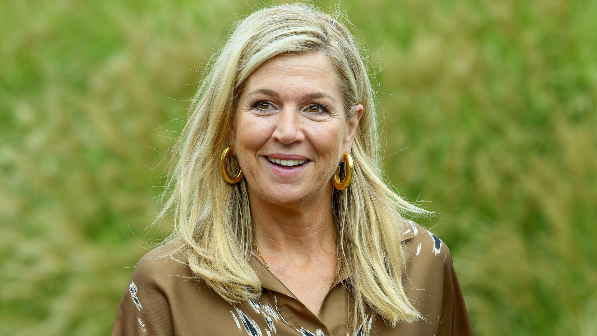 Queen Máxima transforms her silky brown dress with one bold statement accessory amid busy royal week