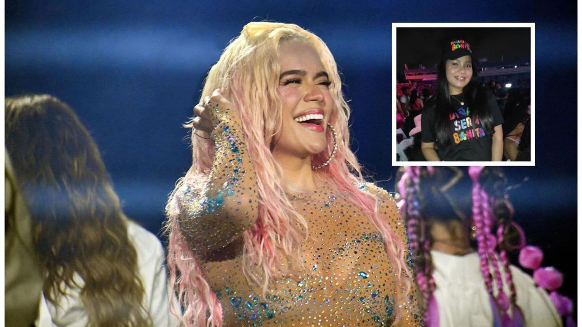 Karol G helps a fan with her gender reveal during the singer’s Dominican Republic concert