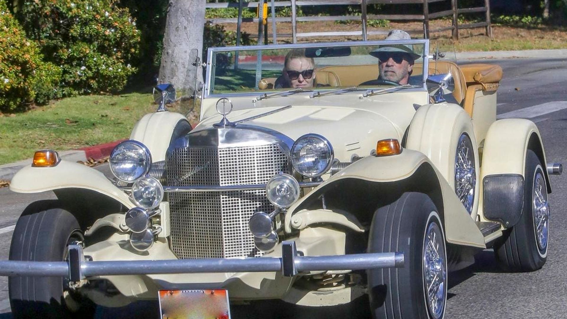 Arnold Schwarzenegger takes girlfriend Heather Milligan for a ride in his vintage Mercedes