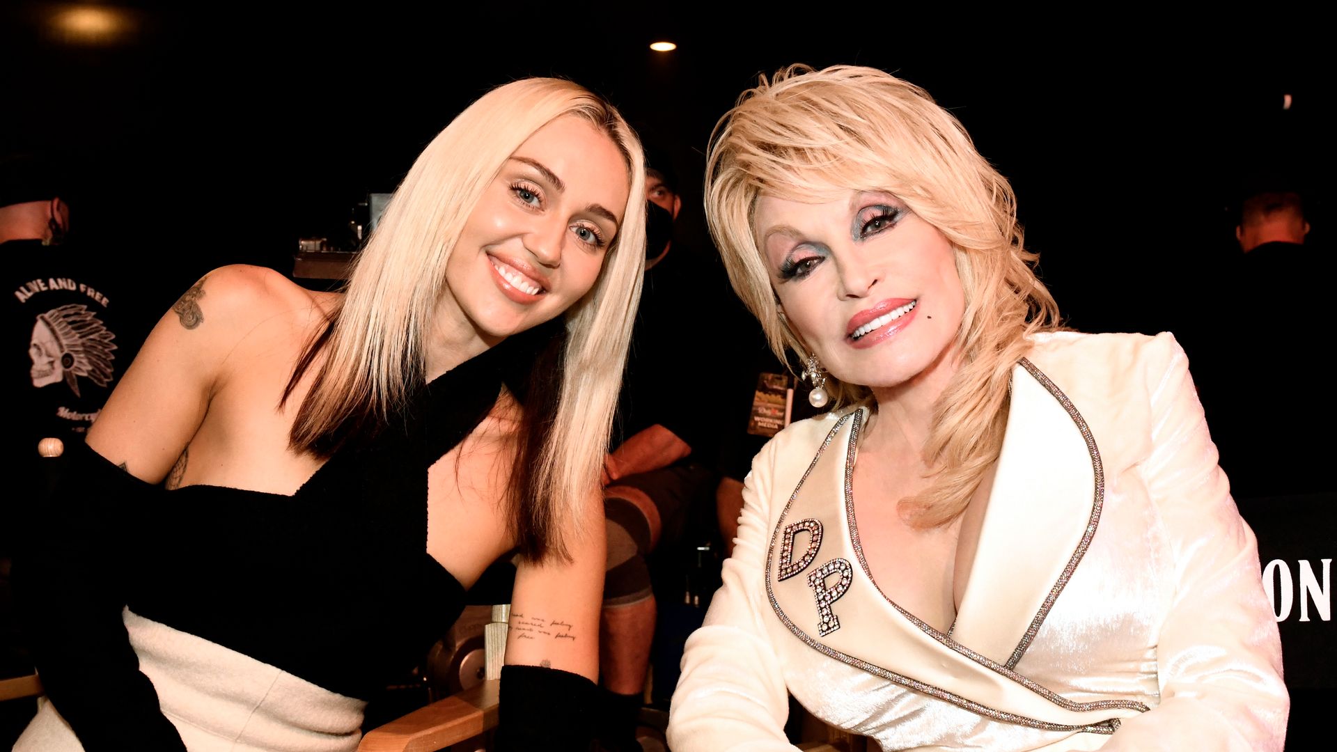 DOLLY PARTON'S MOUNTAIN MAGIC CHRISTMAS -- Pictured: (l-r) Miley Cyrus, Dolly Parton -- (Photo by: Katherine Bomboy/NBC via Getty Images )