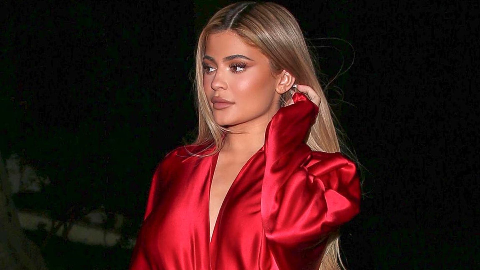 Kylie Jenner turned heads in a fiery red and bright orange outfit while going to dinner