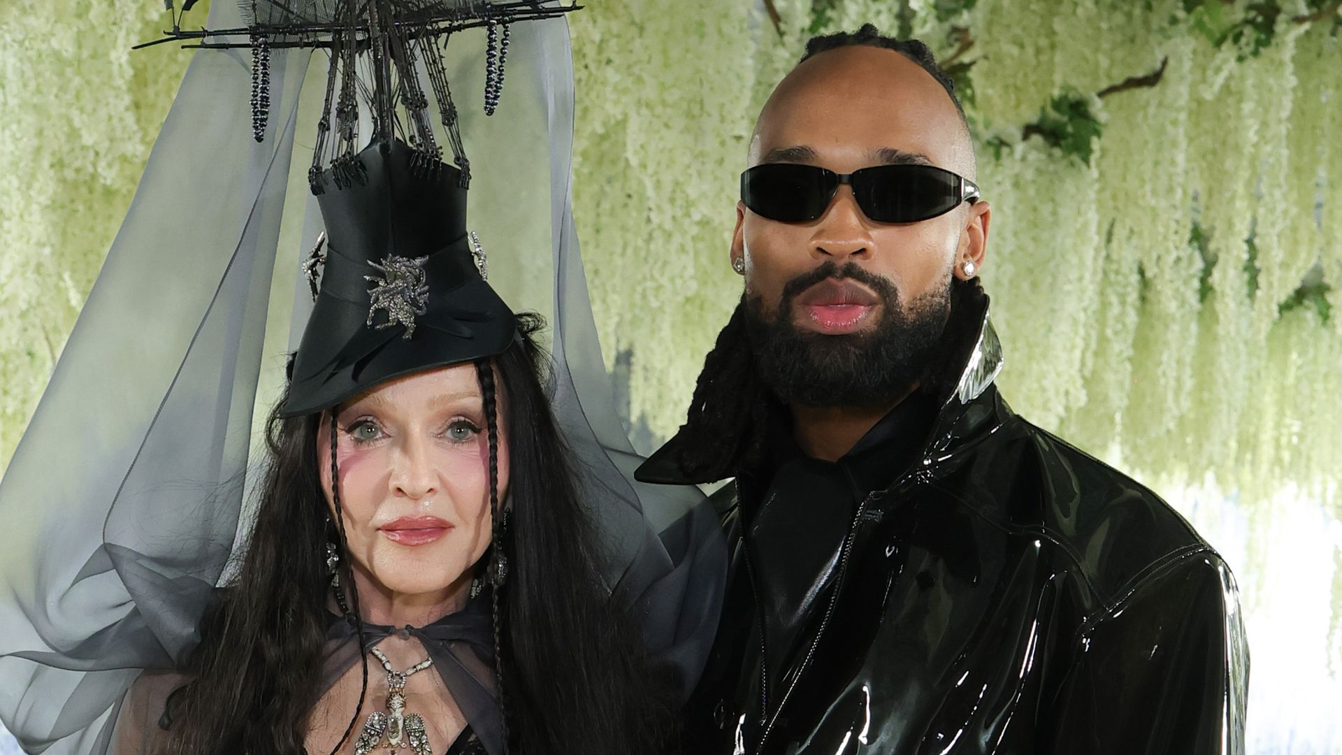 Madonna and boyfriend Akeem Morris look bundled up and in love at JFK Airport