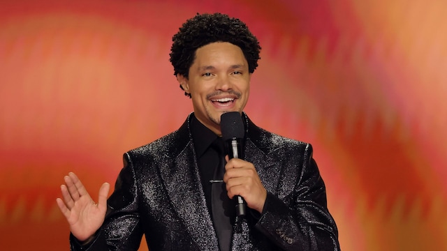 LOS ANGELES, CALIFORNIA - FEBRUARY 04: Trevor Noah speaks onstage during the 66th GRAMMY Awards at Crypto.com Arena on February 04, 2024 in Los Angeles, California. (Photo by Kevin Winter/Getty Images for The Recording Academy) 