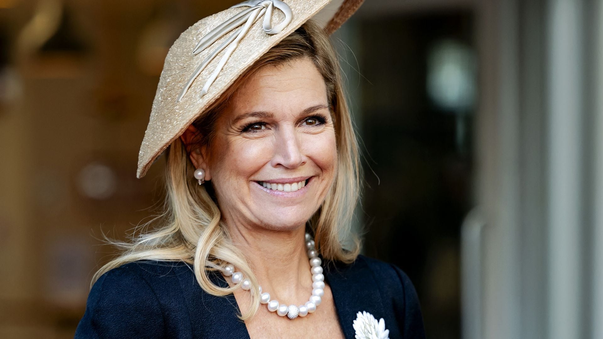 Máxima of the Netherlands channels Princess Diana with a daring red-and-purple ensemble
