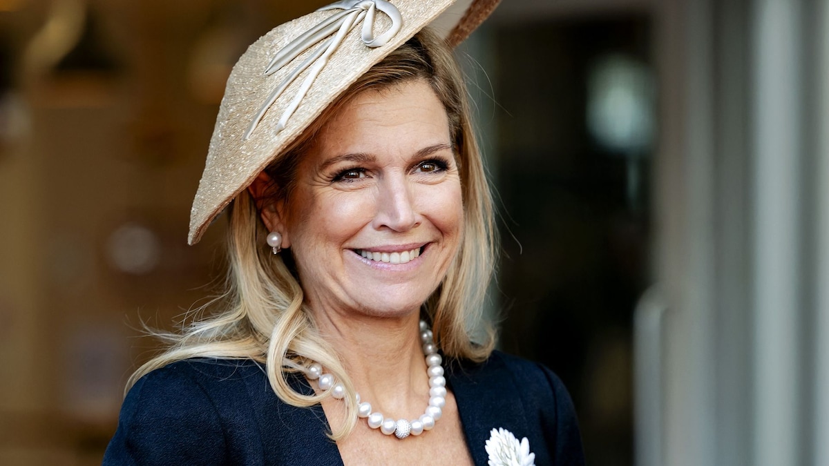 Máxima of the Netherlands channels Princess Diana with a daring red-and-purple ensemble