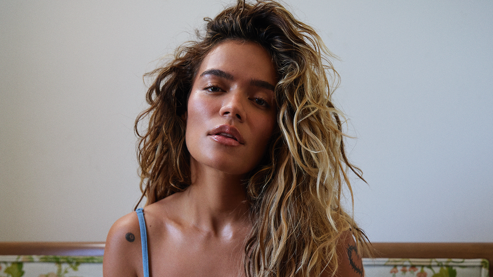 Karol G wears nothing but micro shorts and opens up about her breakup with Feid: 'I’m letting go'