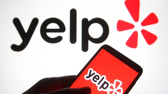 In this photo illustration a Yelp logo is seen on a