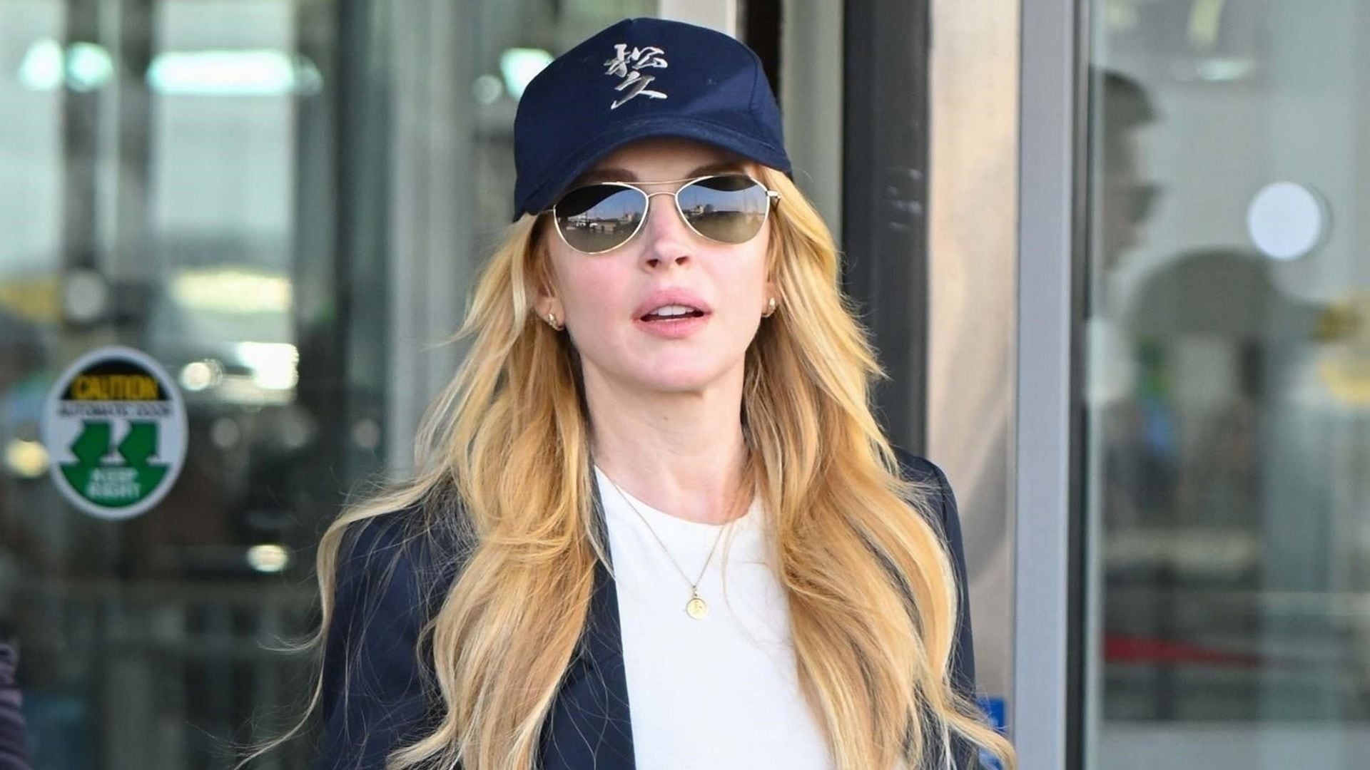 Lindsay Lohan nails mom-chic style while touching down in New York with her family