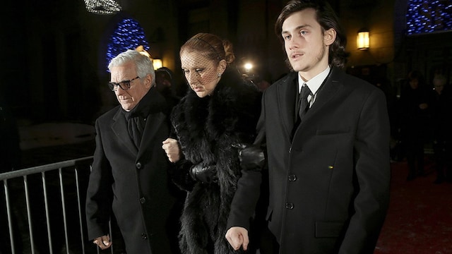 Rene Charles, left, supported his mother Celine during the public wake.
<br>
Photo: Getty Images