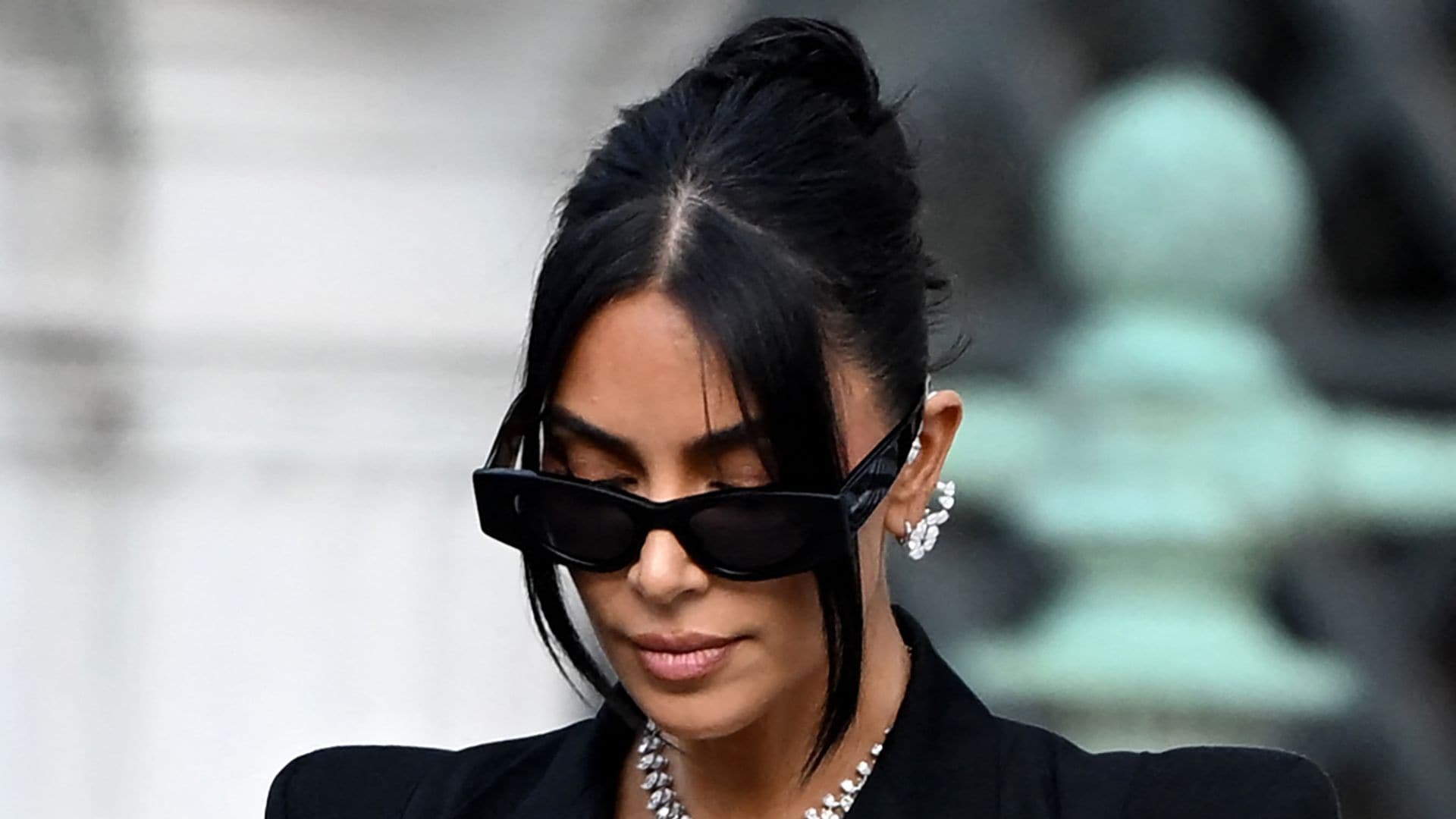 TOPSHOT - US celebrity Kim Kardashian leaves the Assize Court after testifying in a trial over the 2016 robbery that saw her relieved of millions of dollars' worth of jewellery at gunpoint in Paris, on May 13, 2025. The trial of this sensational nine million euro jewellery robbery opened in Paris on April 28, 2025. (Photo by LEO VIGNAL / AFP) (Photo by LEO VIGNAL/AFP via Getty Images)           