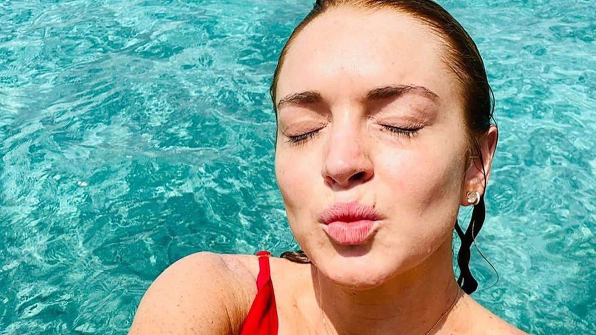 Lindsay Lohan bares it all in plunging red swimsuit in Maldives