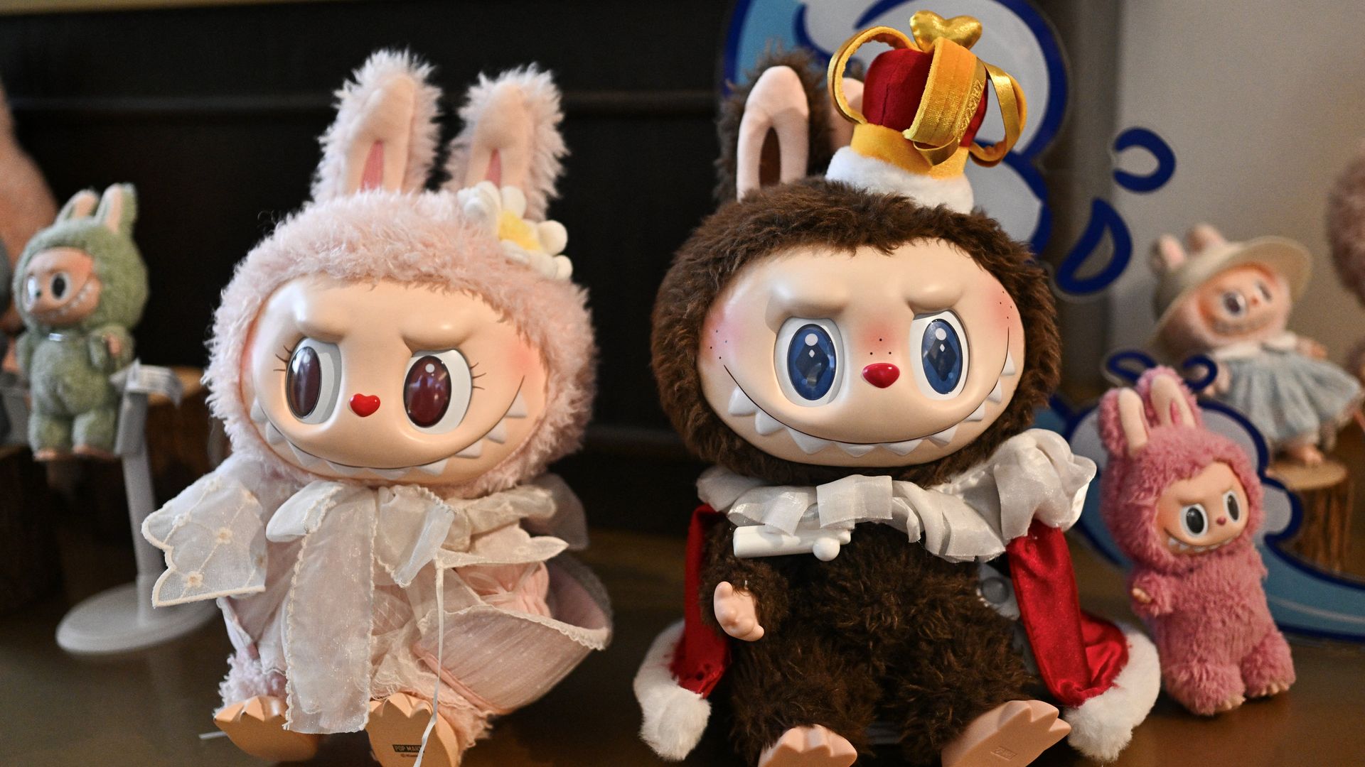 This picture taken on June 18, 2025 shows figures of the characters Mokoko and Labubu in an exhibition room at Pop Mart's theme park Pop Land in Beijing