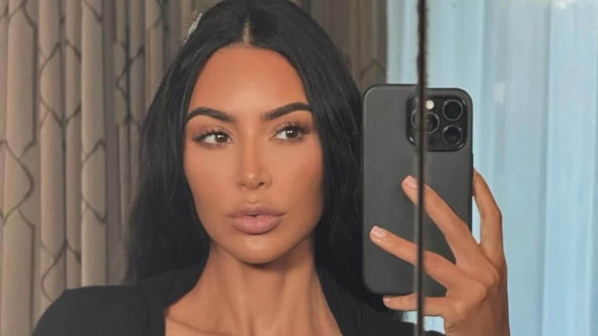 Kim Kardashian turns up the heat in black cut-out bikini and gold jewelry