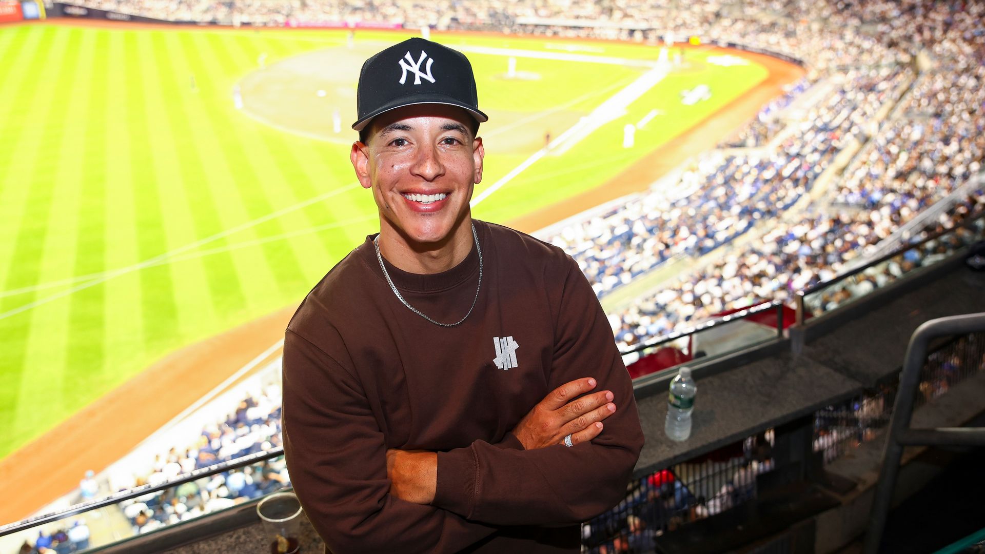 : Daddy Yankee poses for a photo in a suite during Game Three of the American League Division Series presented by Booking.com between the Toronto Blue Jays and the New York Yankees at Yankee Stadium on Tuesday, October 7, 2025 in New York, New York. (Photo by Phebe Grosser/MLB Photos via Getty Images)