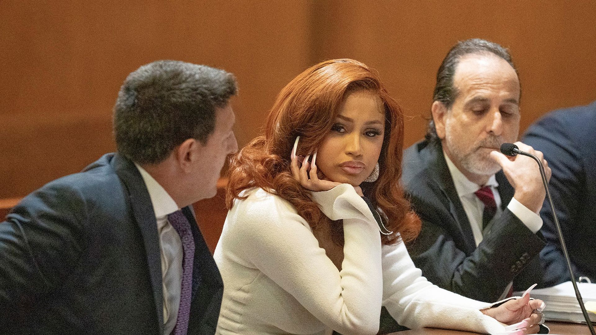 US rapper and songwriter Cardi B (C) appears at Queens County Criminal Court in New York on September 15, 2022. - Cardi B is appearing in court for a hearing regarding charges of assaulting two strippers. (Photo by Dennis A. Clark / POOL / AFP) (Photo by DENNIS A. CLARK/POOL/AFP via Getty Images) 