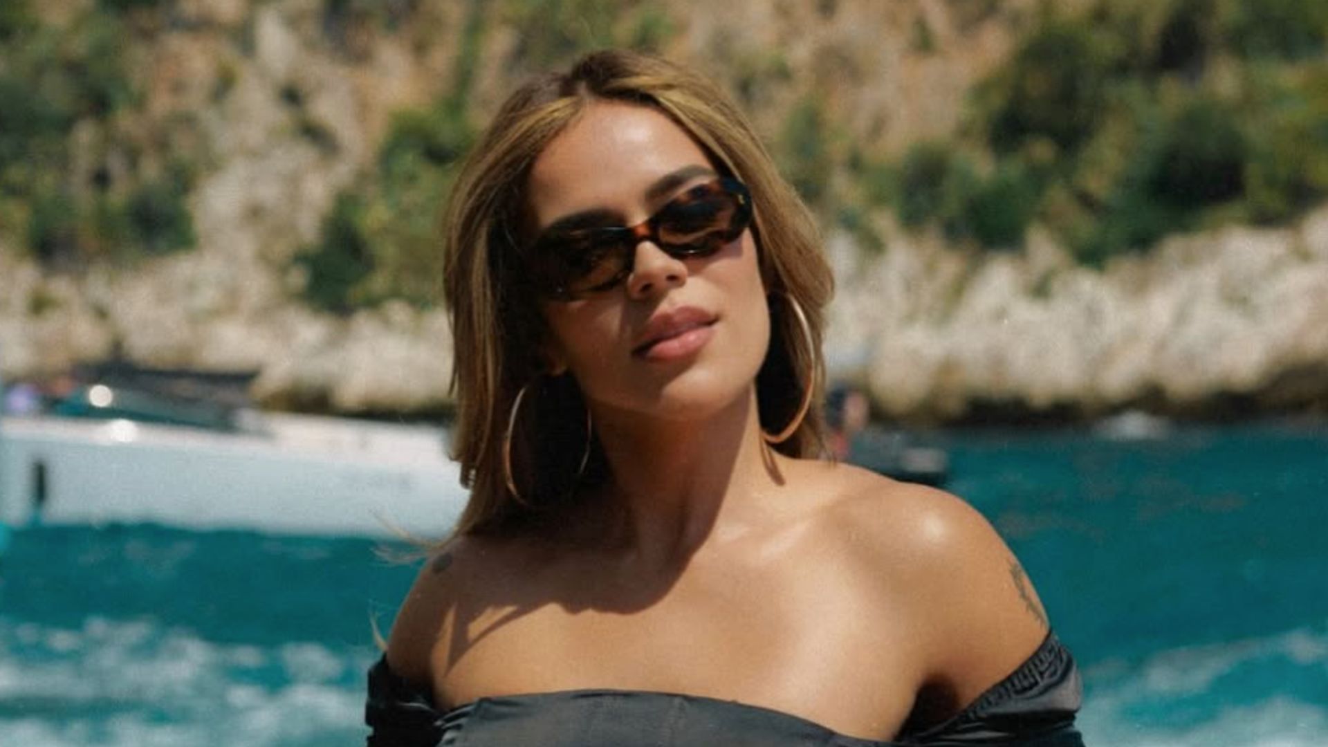Karol G shows her abs while soaking up the Formula 1 atmosphere in Monaco