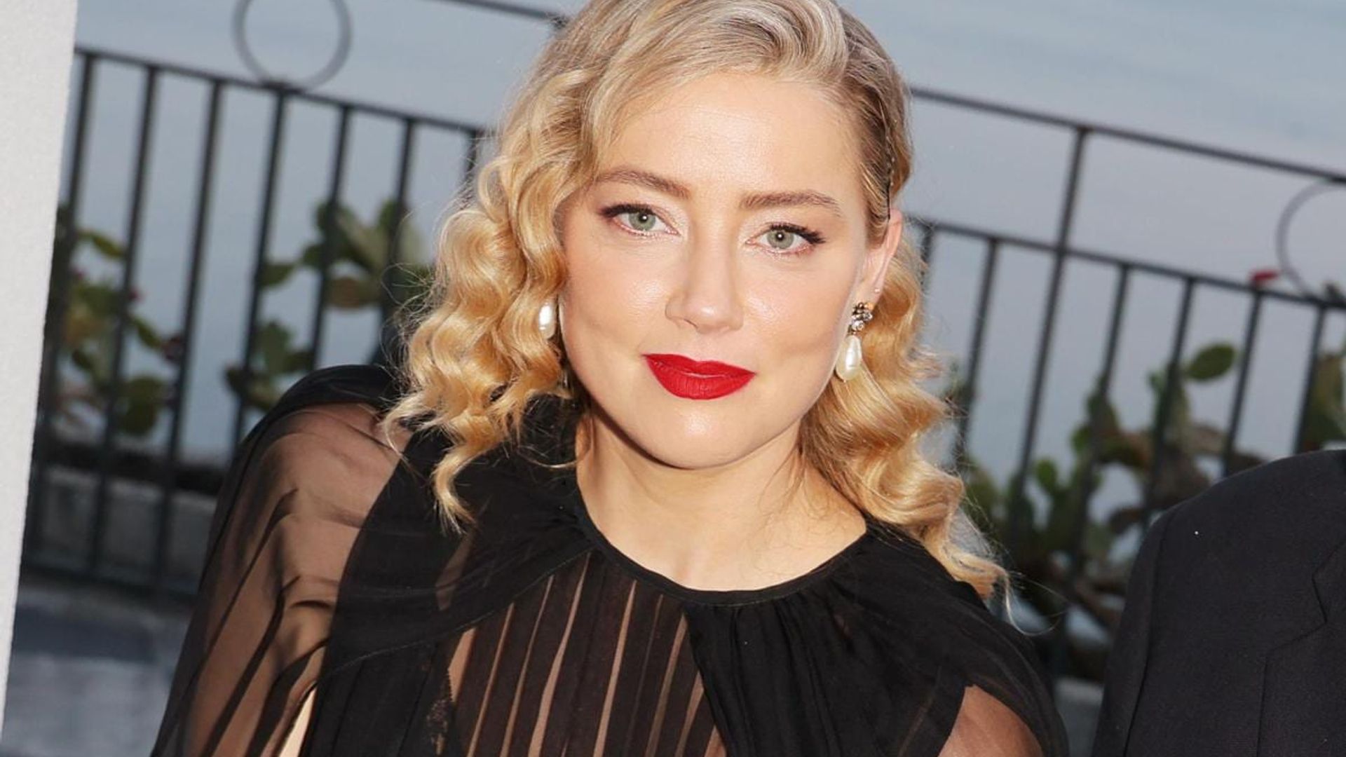 Amber Heard is all smiles celebrating her birthday with champagne