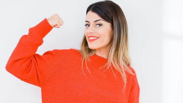 A healthy woman in a red sweater
