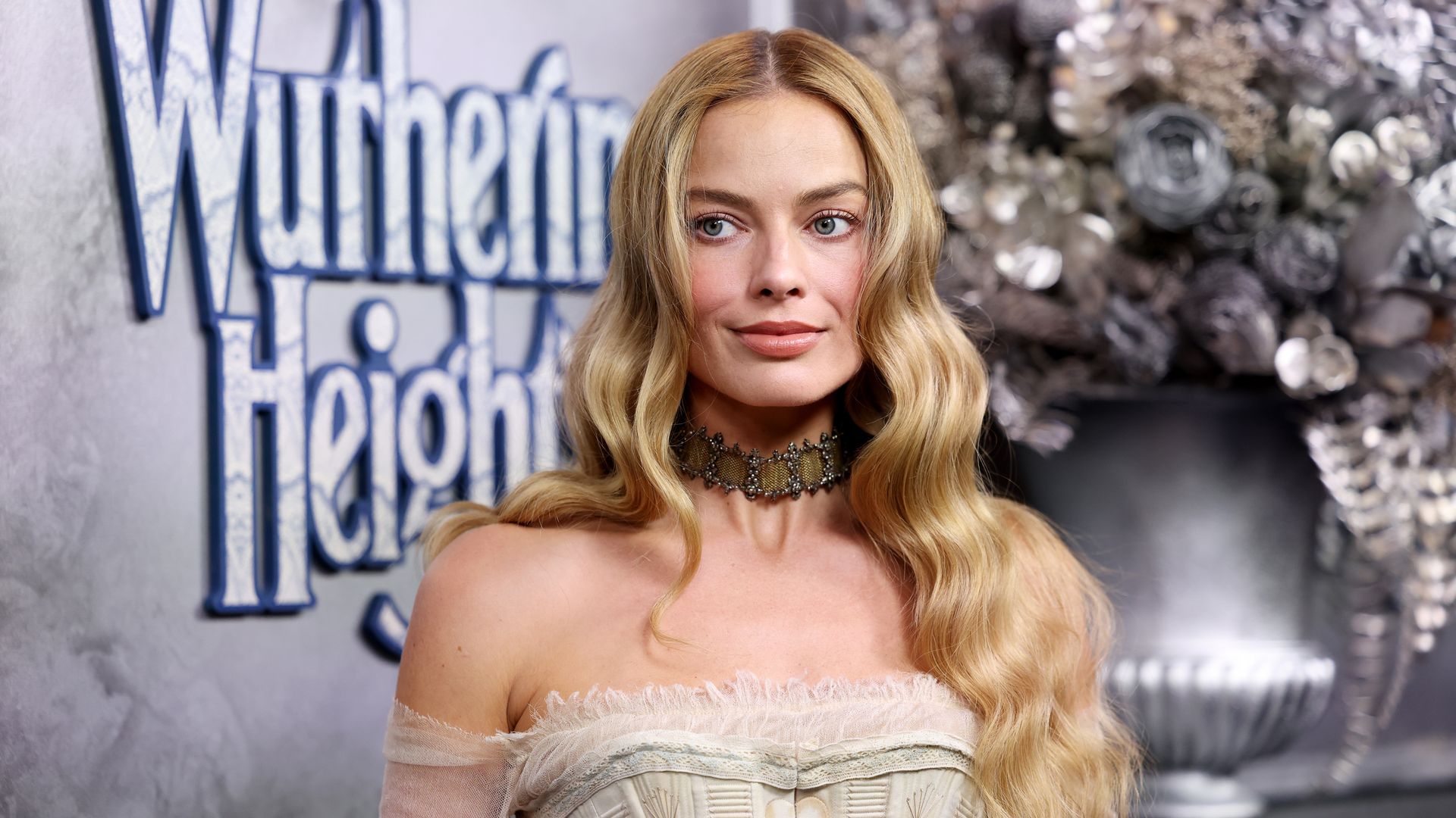 Margot Robbie debuts chic haircut with bangs at Paris Fashion Week