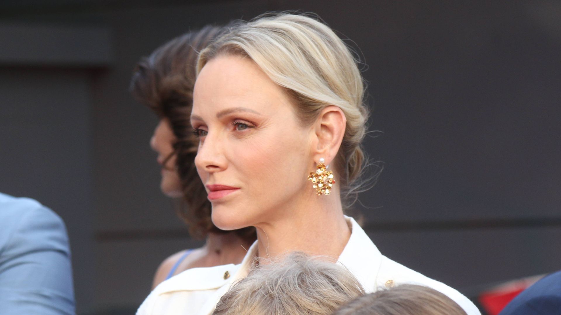 Princess Charlene adds a golden touch to sophisticated power suit for palace appearance