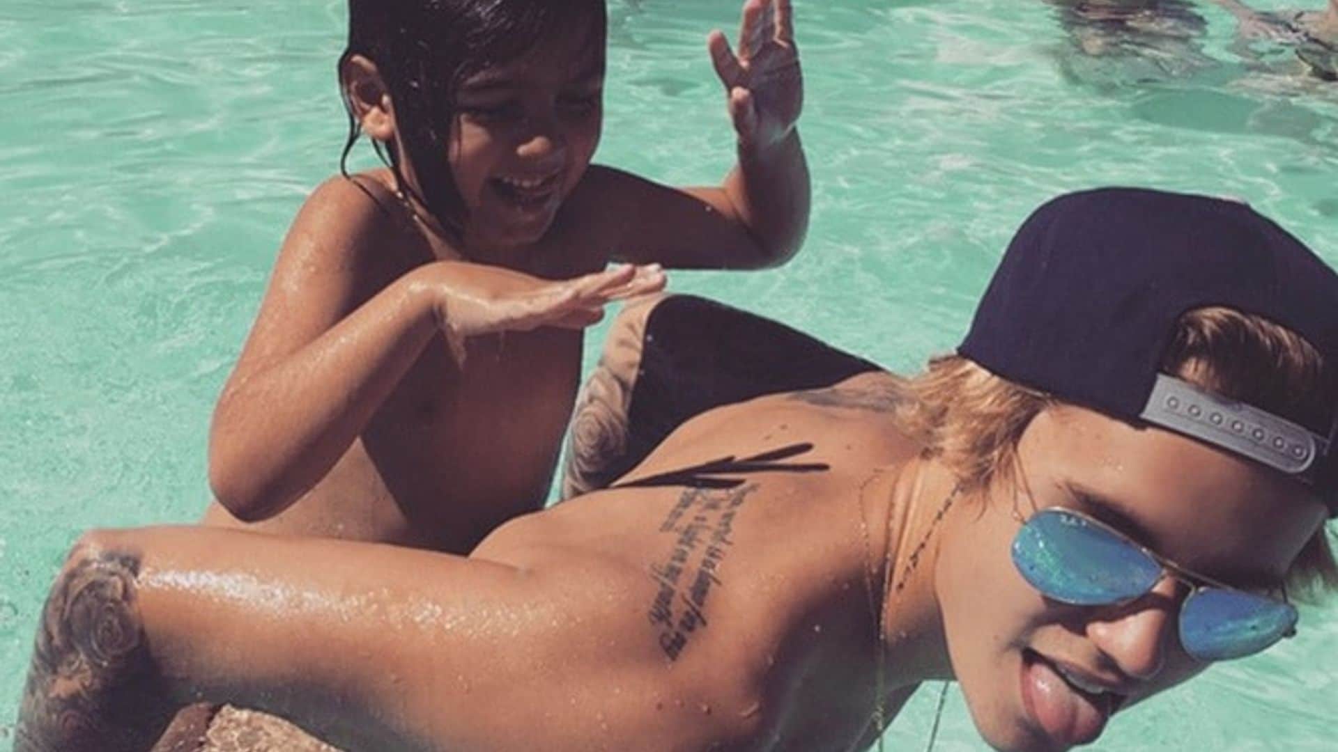 Shirtless, tanned Justin Bieber and Mason Disick have fun pool day