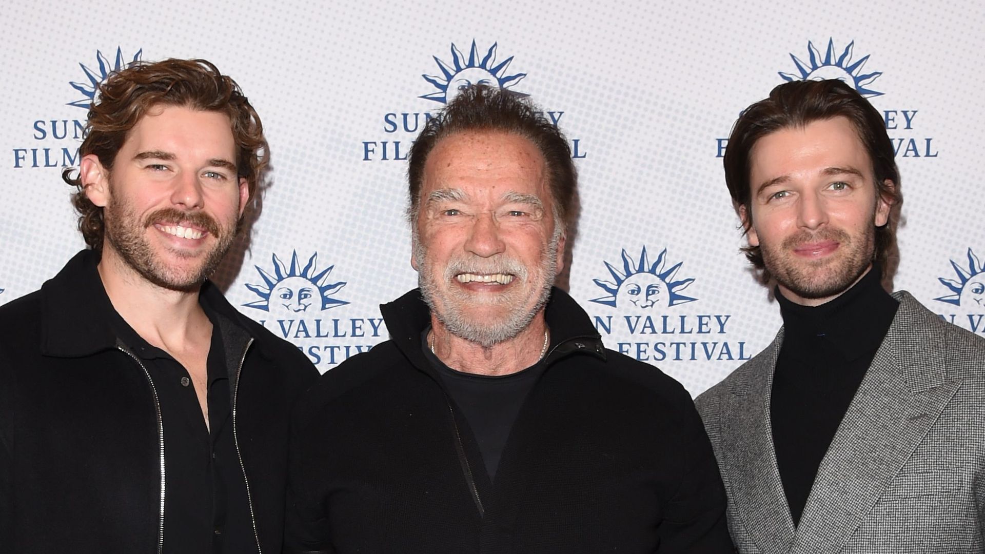 Arnold Schwarzenegger steps out for rare red carpet moment with sons Patrick and Christopher