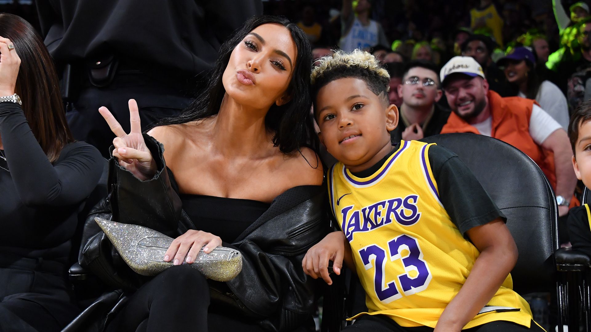Kim Kardashian and Saint West attend a basketball game between the Los Angeles Lakers and the Phoenix Suns at Crypto.com Arena on December 05, 2023 in Los Angeles, California. NOTE TO USER: User expressly acknowledges and agrees that, by downloading and or using this photograph, User is consenting to the terms and conditions of the Getty Images License Agreement. (Photo by Allen Berezovsky/Getty Images)