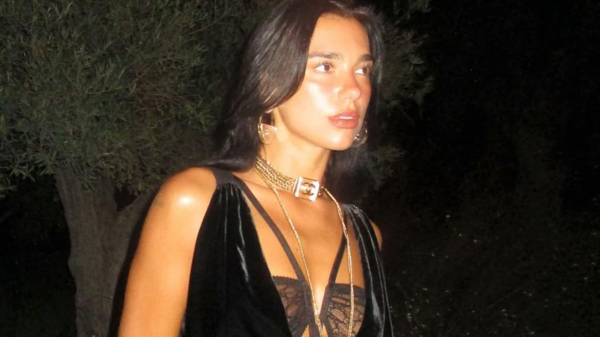 Dua Lipa’s Labor Day outfit includes white see-through dress and thigh-high boots