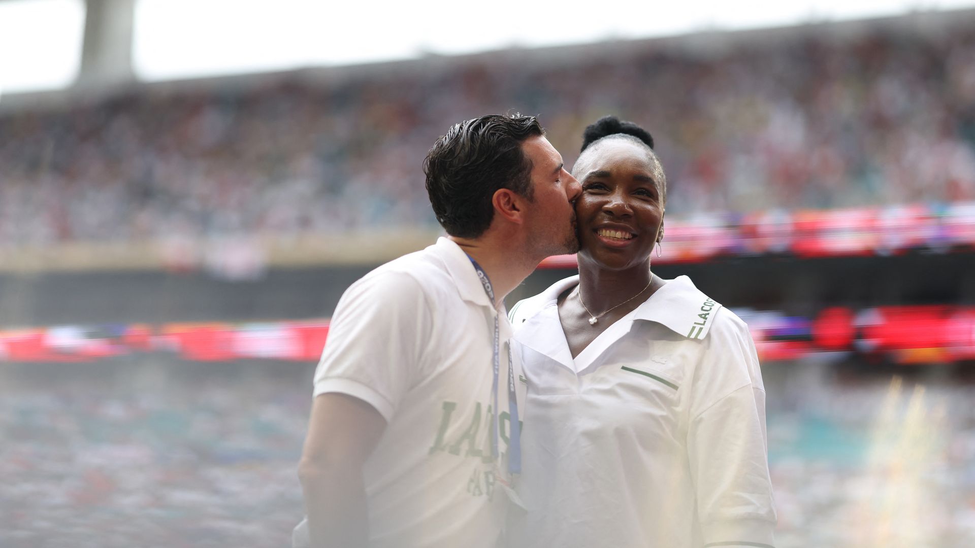 US tennis player Venus Williams is kissed by her husband Andrea Preti 