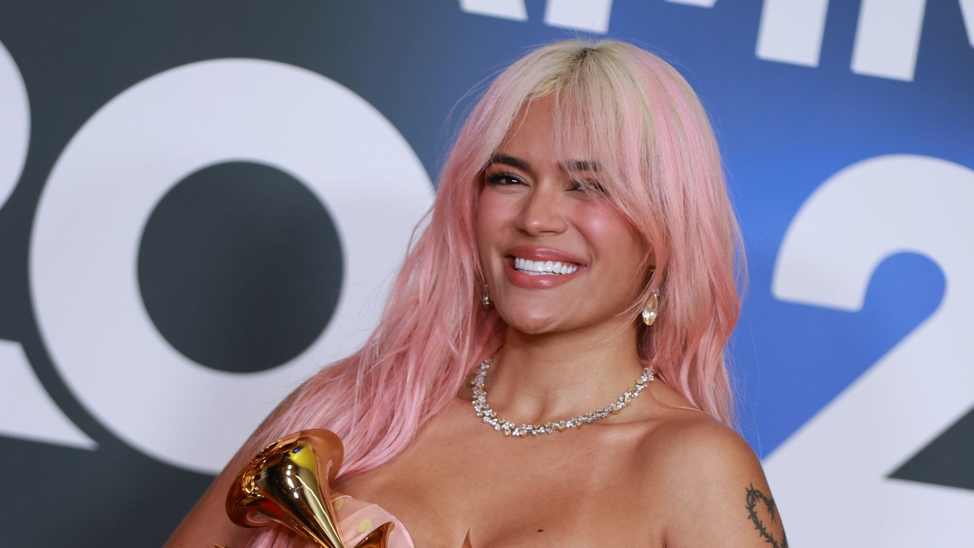 SEVILLE, SPAIN - NOVEMBER 16: Karol G poses with the awards for Best Recording of the Year, Best Urban Album of the Year, and Best Album of the Year in the media center for The 24th Annual Latin Grammy Awards at FIBES Conference and Exhibition Centre on November 16, 2023 in Seville, Spain. (Photo by Patricia J. Garcinuno/WireImage)