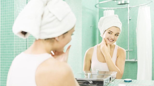 Girl washing her face