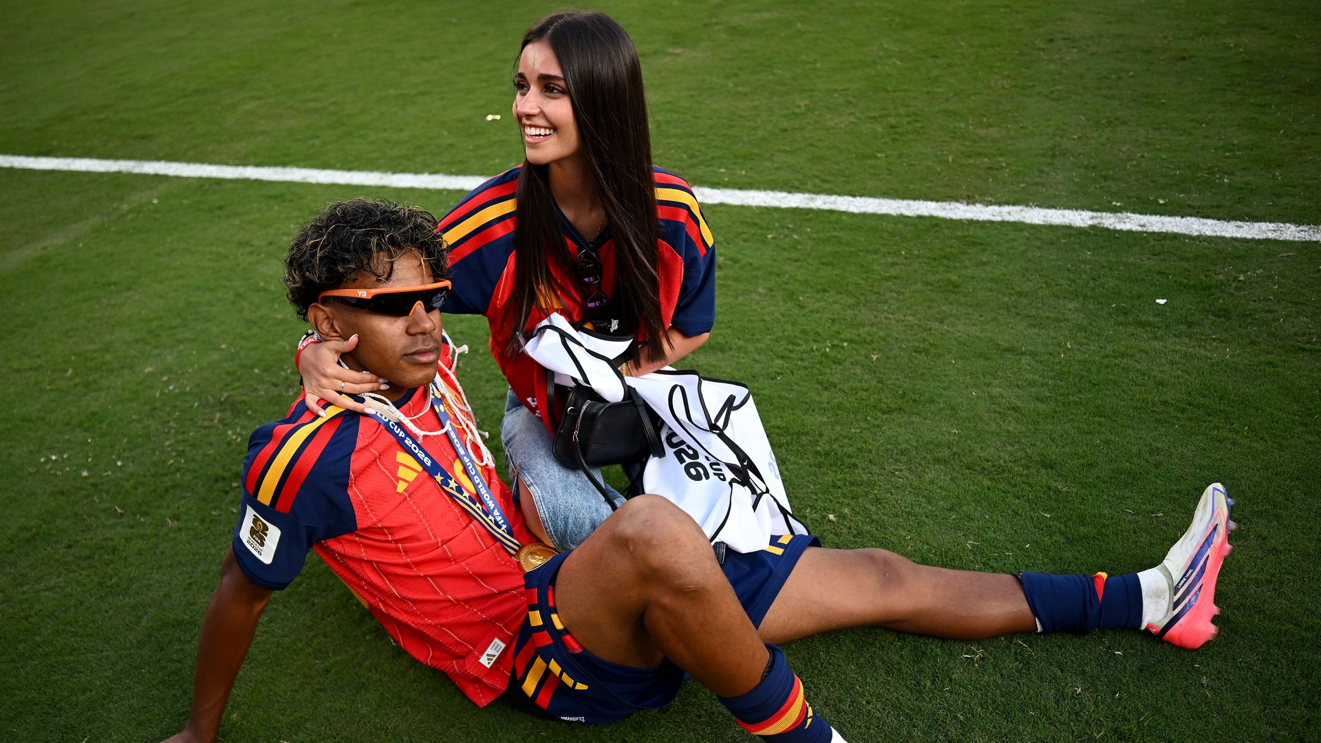 Lamine Yamal #19 of Spain celebrates with his girlfriend Ines Garcia after the team's victory following the FIFA World Cup 2026 Final match between Spain and Argentina at New York New Jersey Stadium on July 19, 2026 in East Rutherford, New Jersey. (Photo by Hannah Peters - FIFA/FIFA via Getty Images)