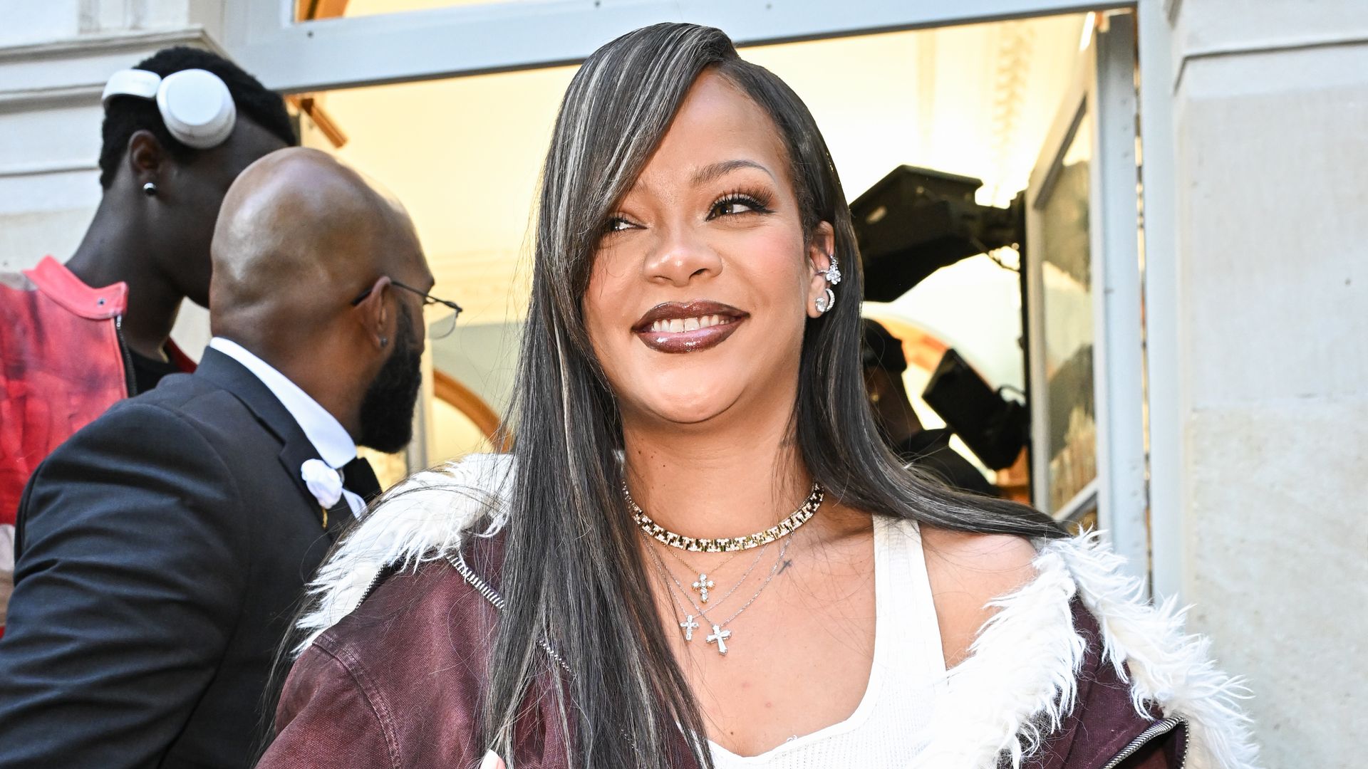 Rihanna’s airport outfit features the perfect mix of comfort and luxury with a fur coat and navy bandana