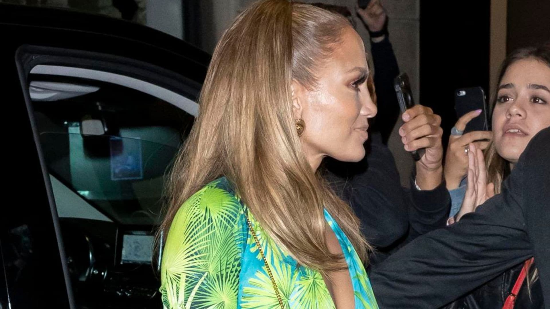 Jennifer Lopez take a cue from herself in a Versace mini dress