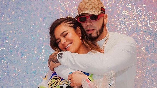Karol G and Anuel AA posing together at her birthday party