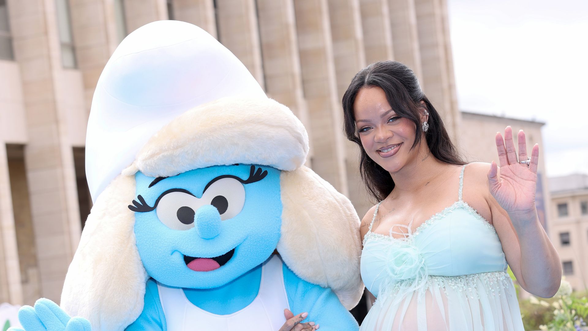 Rihanna shows off her baby bump in sheer Chanel look at Smurfs premiere