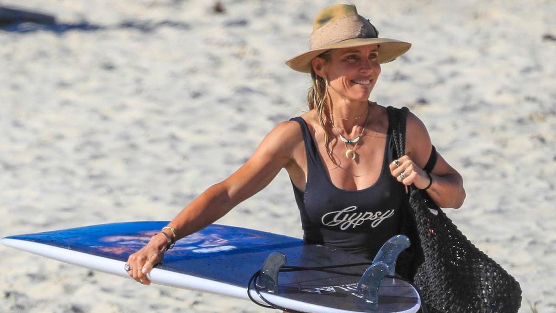 Thor who? Elsa Pataky looks perfectly toned during surf lessons