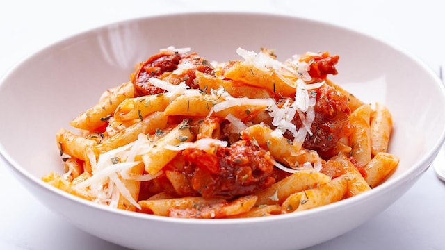 Front view of penne with chorizo and tomato sauce
