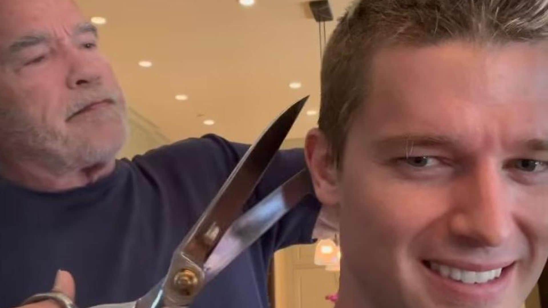 Arnold Schwarzenegger gives Patrick a Terminator approved haircut using large shears