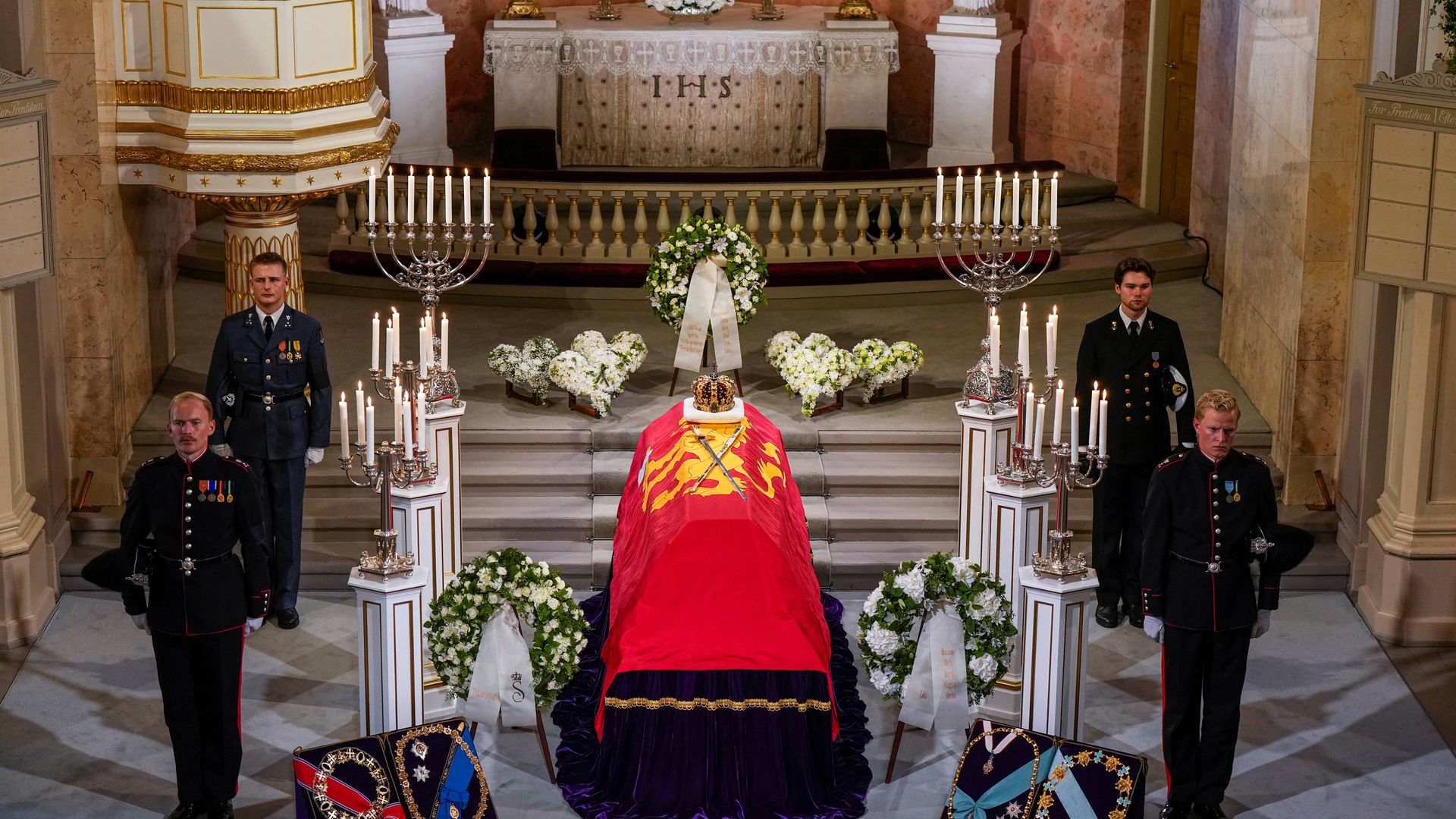 The casket of King Harald V of Norway with the Royal Regalia of Norway, the King's Crown and the Sword of the Realm resting on top, is pictured as the late monarch lies in state at the Royal Palace Chapel in Oslo on August 31, 2026.