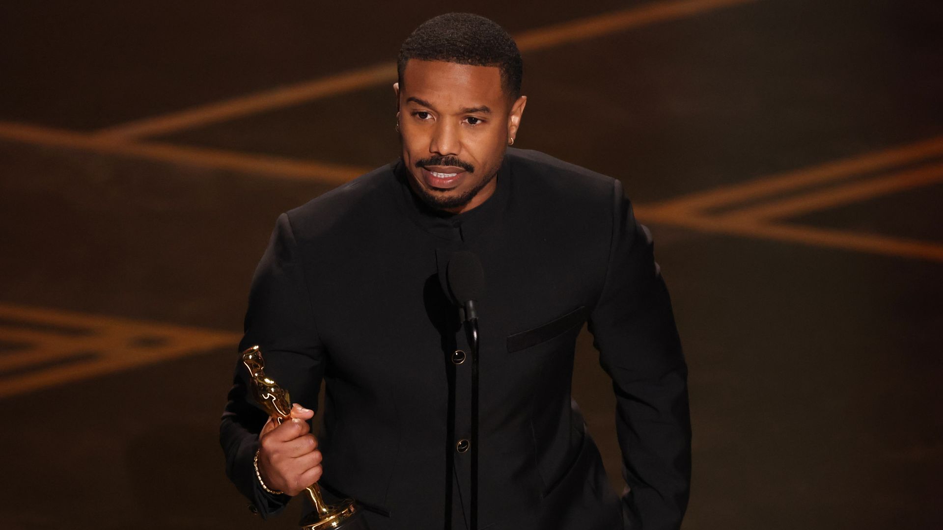 HOLLYWOOD, CALIFORNIA - MARCH 15: Michael B. Jordan accepts the Actor in a Leading Role award for "Sinners" onstage during the 98th Oscars at Dolby Theatre on March 15, 2026 in Hollywood, California. (Photo by Kevin Winter/Getty Images) 